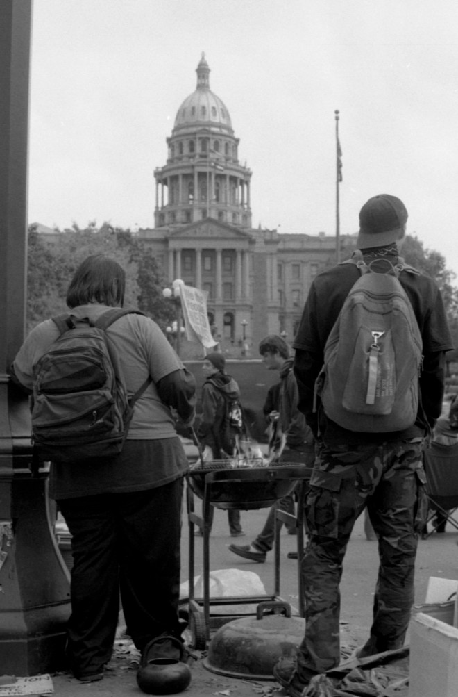 Occupy Denver demonstrators warm themselves