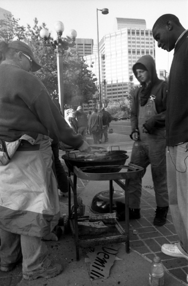 Occupy Denver cooking over a fire