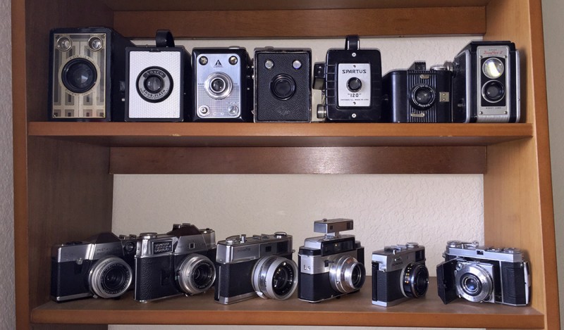 Box cameras on a shelf